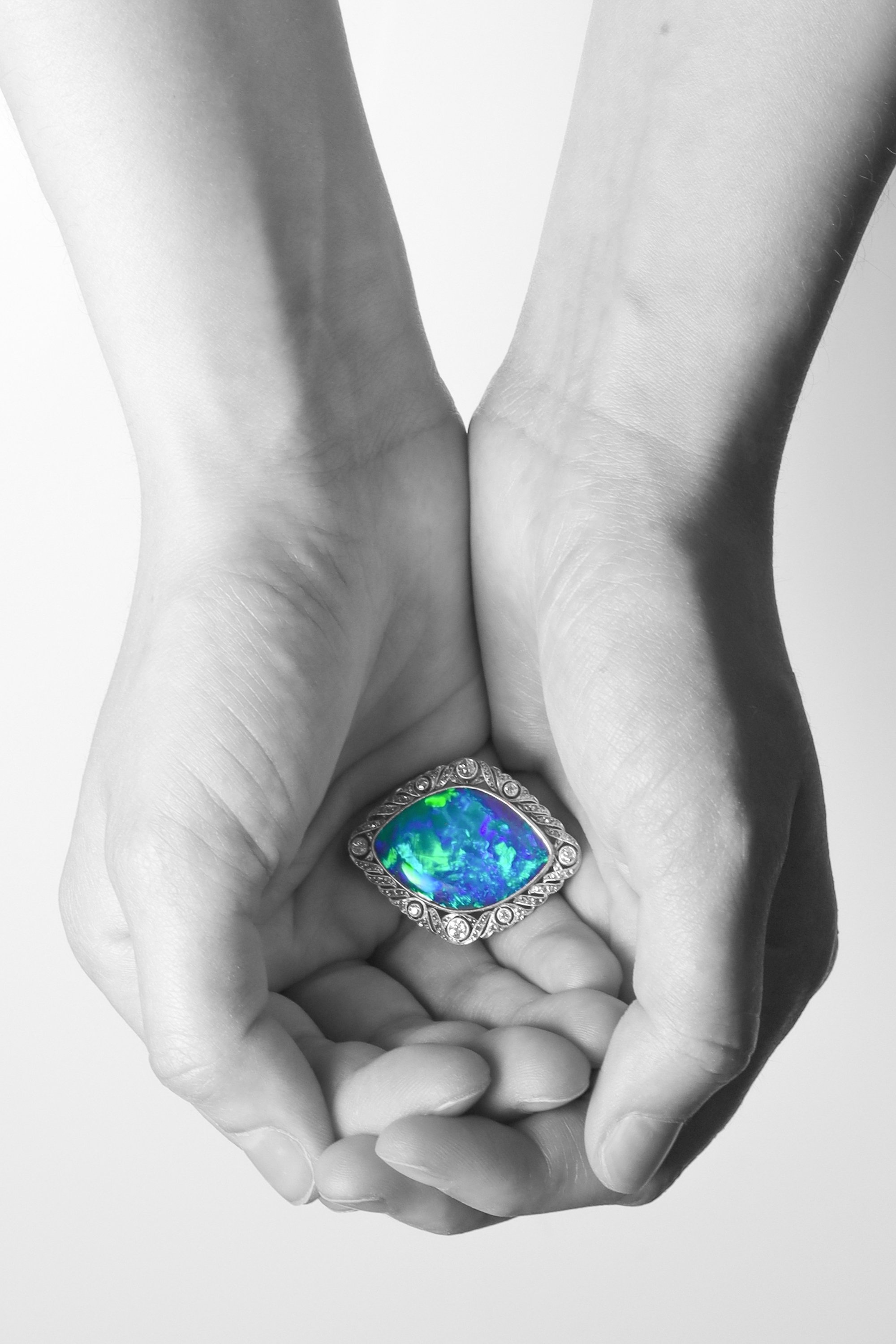 Click the picture to find out more about this Antique Cosmic Dance: 24ct Black Opal Brooch from 1920
